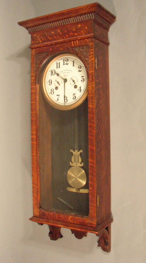 Simplex Time Recorder Co hanging wall clock in q: Simplex Time Recorder Co hanging wall clock in quarter sawn oak case. 45" h x 17 1/2" w x 8 3/4" d