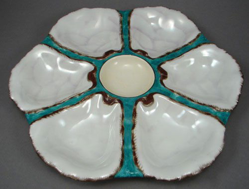 Antique Porcelain Oyster Plate of simple design. M: Antique Porcelain Oyster Plate of simple design. Maker unknown. 9 1/4" diameter.