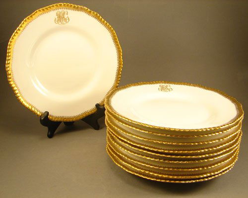 10 "D & C" French Fine Porcelain Service Plates w: 10 "D & C" French Fine Porcelain Service Plates with gilt monogram. Marked on reverse "L. Bernardaud & Co. Limoges". One with a small rim chip. Each 9 1/2" diameter.