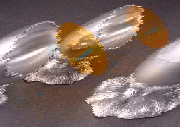 160A: Two Figural Silver plated Egg Cups w/gold washed: Two Figural Silver plated Egg Cups w/gold washed interior. Each in the form of half an egg shell cracked open and resting on a bed of leaves. 19th c. 2 1/4"h x 3"w x 2 1/4"d