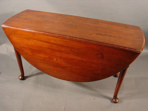 Fine American Cherry Queen Anne Drop Leaf Dining Ta: Fine American Cherry Queen Anne Drop Leaf Dining Table with pad feet. ca. 1740. Some stains, older professional finish. Minor repairs. 28" h x 56" (18 1/2" closed) x 53"