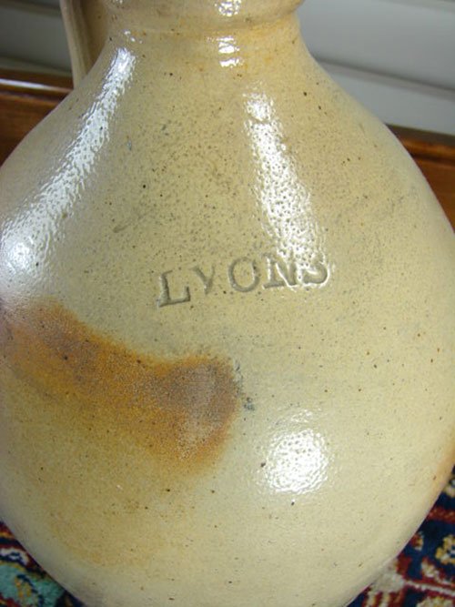 Lyons Signed 1 Gallon Stoneware Jug. 10 1/2" h x 6 1 - 2
