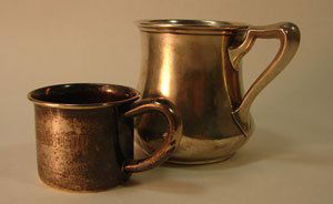 Two Sterling Silver Child's Mugs. Including Gorha: Two Sterling Silver Child's Mugs. Including Gorham and Lunt. Inscribed "Child's Cup Norfolk Mixed 1971 Finalist" and "Robert" (minor dents). 3" tall x 4" diameter and 2" tall x 3" diameter.