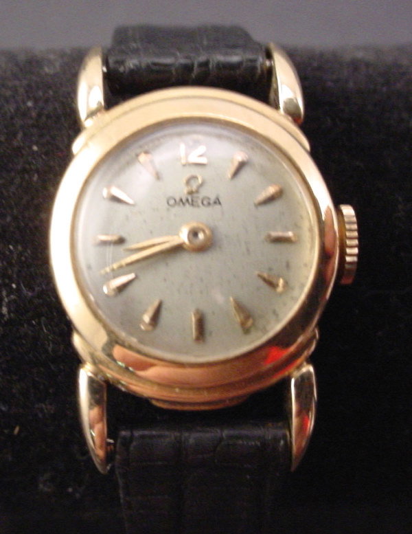 14k "Omega" Ladies Watch with Leather Band.