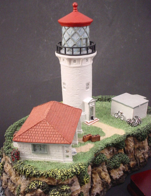 3 Cast Resin light house figures. - 3