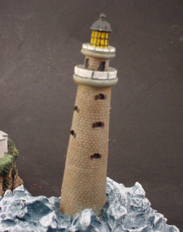 3 Cast Resin light house figures. - 4