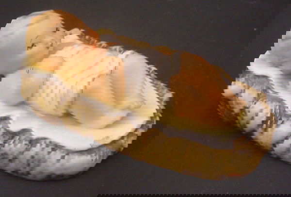 "Hummel" Figurine. Numbered "18". Titled "Christ: "Hummel" Figurine. Numbered "18". Titled "Christ Child". Trademark 2 Full Bee. 2 1/2"h x 6 1/4"w x 3 3/4"d