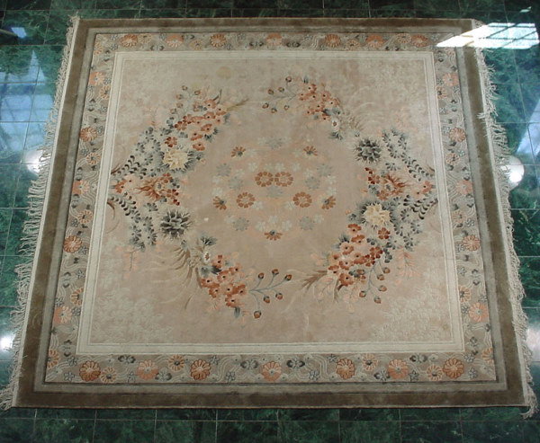 Fine Hand Woven Silk Carpet with a floral medallio