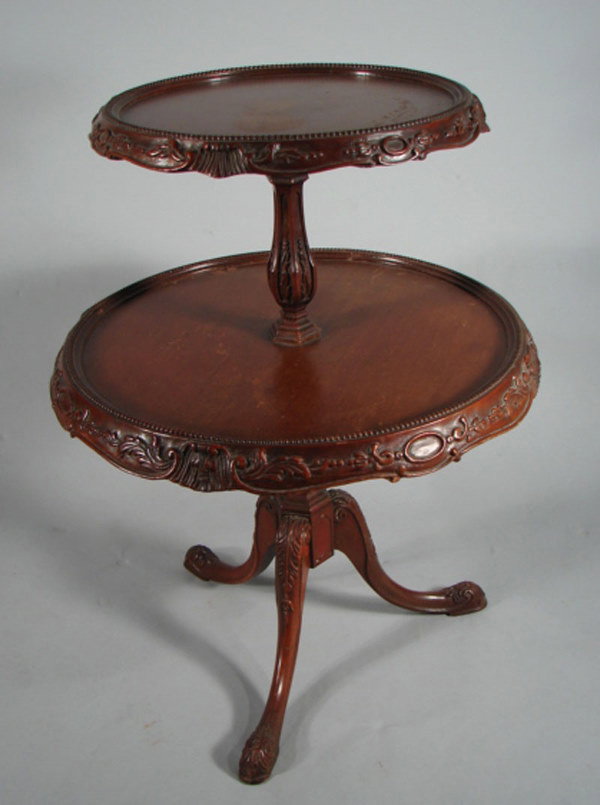 Two tiered stand. 32"h x 24"diam at widest.
