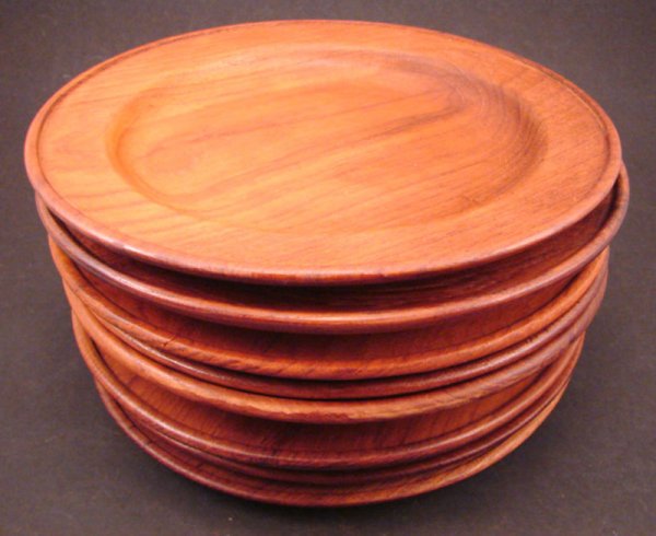 Eight Teak Plates. Marked "Made in Thailand Galax