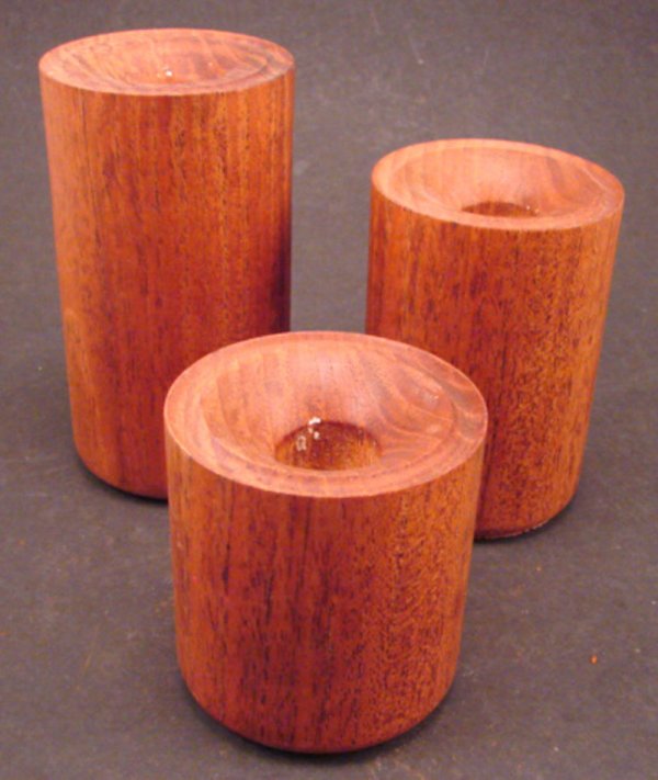 Three Teak Turned Candle Holders in graduating he