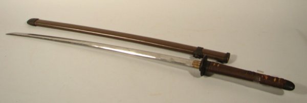 Japanese Sword / Katana with scabbard. Signed and