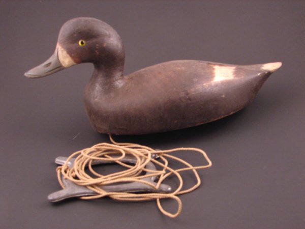 Roy Conklin Duck Decoy with plaque on bottom reads: Roy Conklin Duck Decoy with plaque on bottom reads "Donald B. Baxter, Syracuse, N.Y.". with weight. Approximately 6 1/2"h x 12"w x 5 1/2"