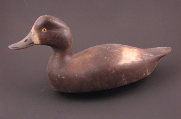 Roy Conklin Duck Decoy with plaque on bottom reads: Roy Conklin Duck Decoy with plaque on bottom reads "Donald B. Baxter, Syracuse, N.Y.". with weight. Approximately 6 1/2"h x 12"w x 5 1/2"