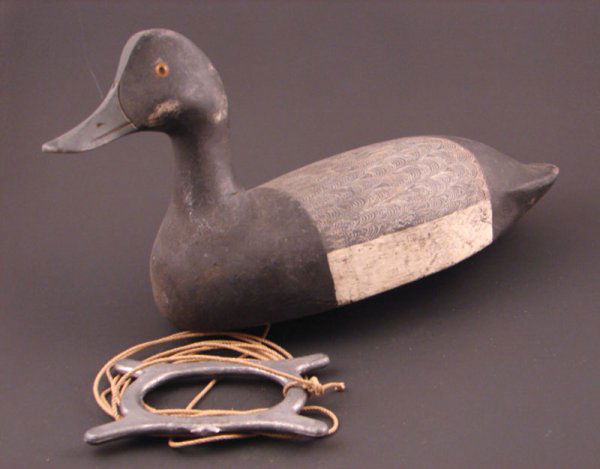 Roy Conklin Duck Decoy with plaque on bottom reads: Roy Conklin Duck Decoy with plaque on bottom reads "Donald B. Baxter, Syracuse, N.Y.". with weight. Approximately 8"h x 13"w x 5 1/2"