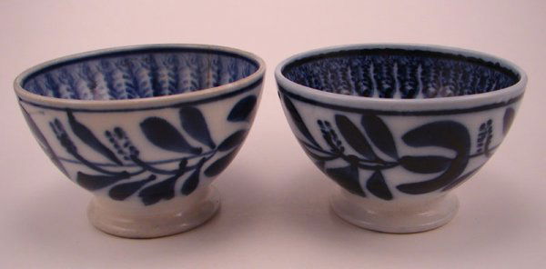 Maestricht Two Flow Blue Spinach Pattern Bowls: Maestricht Two Flow Blue Spinach Pattern Bowls. Both with Imprinted mark. 3"h x 4 7/8" diam. Stamped 3/n? One hairline. 3"h x 4 7/8" diam. (Dutch, Delft like) manufacture red from 1826-1943. The facto
