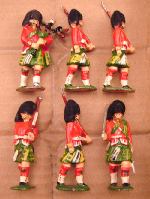 Six Guards and One Bagpipe Player. unmarked
