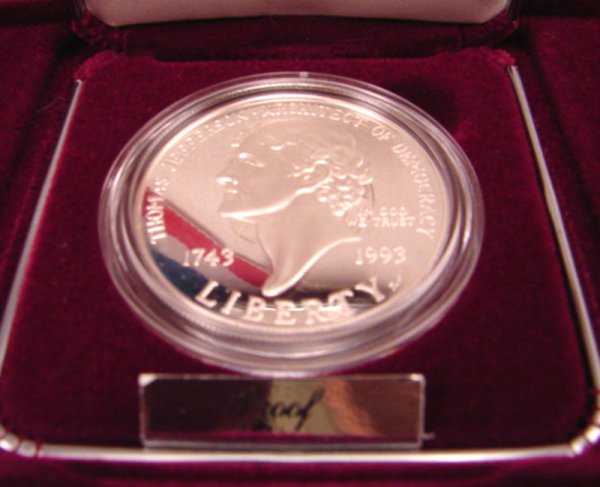Two Thomas Jefferson $1 Commemoratives: one UNC, - 2