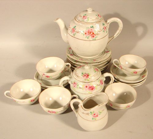Vintage Hand Painted Child's Tea Set: Vintage Hand Painted Child's Tea Set. Japan. Loss to handle of one cup, hairlines. Approximately 19pcs. Plates 4 1/2" diameter.