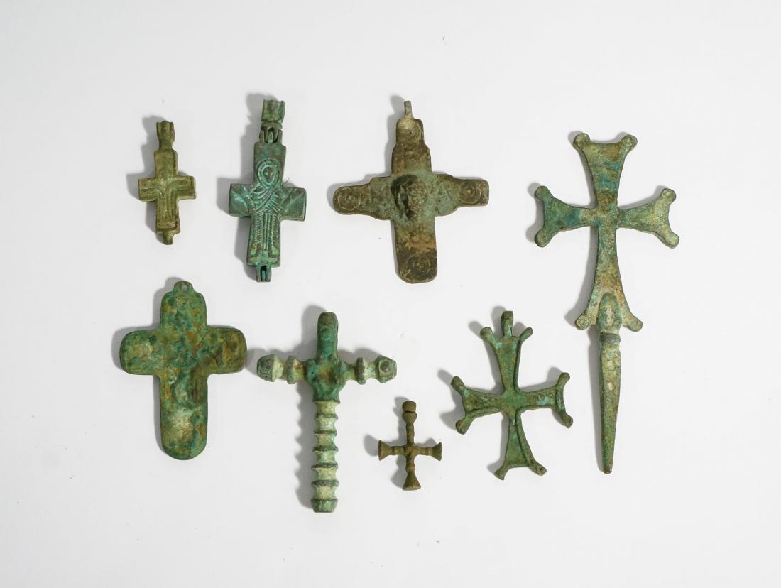 GROUP OF BYZANTINE BRONZE CROSSES: probably 900AD- 1200AD. smallest: H: 1.6in, W: 1in; biggest: H: 5.5in, W: 2.3in.