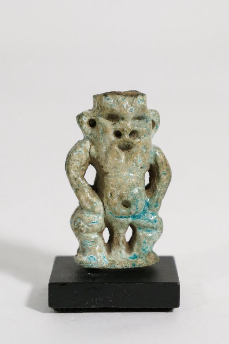 ANCIENT EGYPTIAN TURQUOISE FAIENCE BES AMULET: probably 630 BC - 200 BC. height without stand: 1.75in.