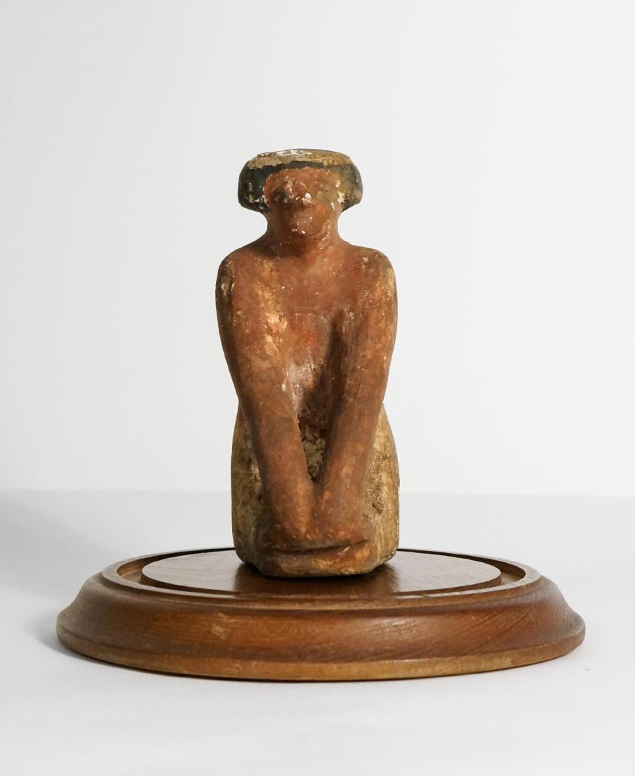 ANCIENT EGYPTIAN WOODEN KNEELING FIGURE: probably 600BC - 400 BC, With display case. Ex Gainesville, Florida,private collection height: 5.25in.