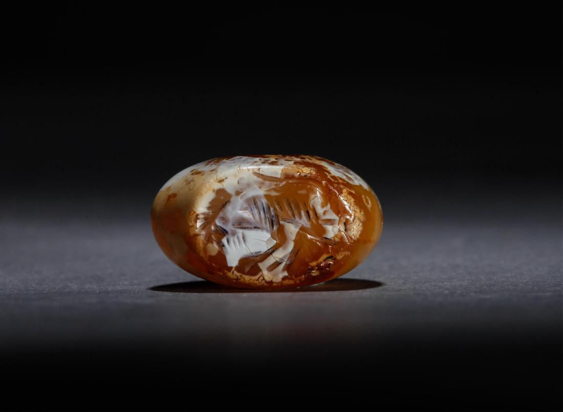 SASANIAN AGATE SEAL WITH MONKEY: Sasanian Empire (224 - 651 A.D.) Material: Agate Dimension: 2x1.6x1.1cm Condition: Intact . The base of the seal is carved with a monkey with foreleg raised