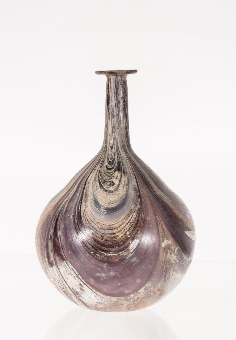 ANCIENT ROMAN MARBLE GLASS FLASK, 100AD -300AD PRO: ANCIENT ROMAN MARBLE GLASS FLASK, 100AD -300AD PROVENANCE : MONTREAL ESTATE, COLLECTION MADE IN THE 80S. Height: 6in.