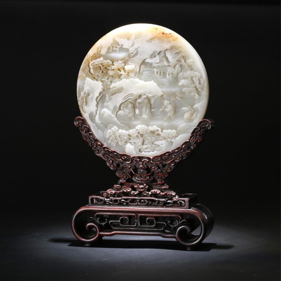 CHINESE WHITE JADE CARVED TABLE SCREEN, QING: Diameter: 7.5 inches. Height: 12.7 inches. Diameter: 19.1cm Height: 32.3cm Weight: 760g Condition: upon request