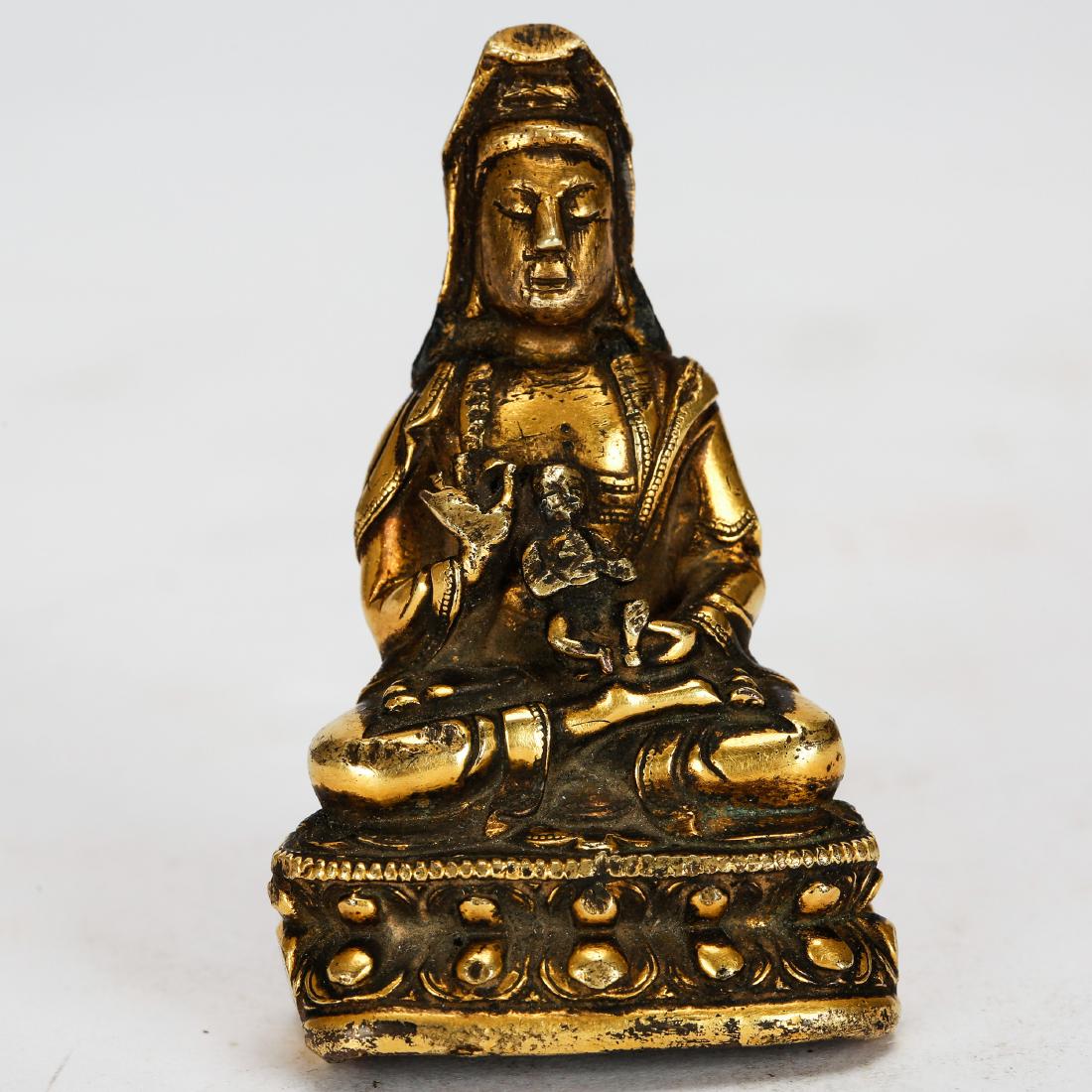 CHINESE GILT BRONZE SEATED GUANYIN QING DYNASTY: Height: 2.1 inches. Height: 5.4cm Weight: 80g Condition: good condition overall, minor faults and wear due to age. Provenance: From a Long Island Estate of Mr. and Mrs. Woldi, who was a major collecto