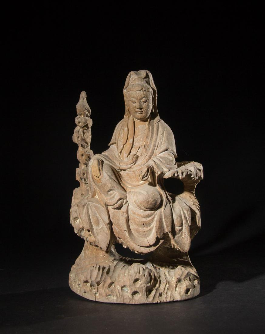 CHINESE WOOD CARVED FIGURE OF GUANYIN: Height: 9.1 inches. Height: 23cm. Provenance: From the collections of Mr. Norman Marcus estates from New York.