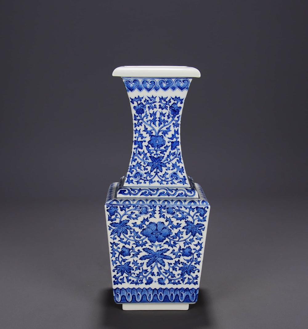 A BLUE WHITE WRAPPED FLOWERS MOTIF PORCELAIN SQUARE: A BLUE WHITE WRAPPED FLOWERS MOTIF PORCELAIN SQUARE VASE. Height: 11.4 inches. 4.7 inches. Height: 29cm Width: 12cm