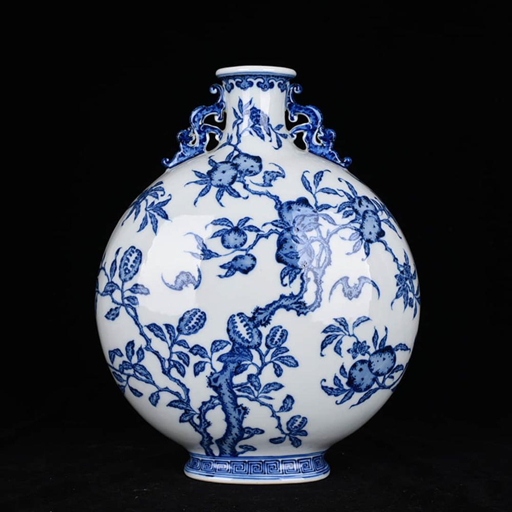 A BLUE WHITE FLORAL PORCELAIN TWIN EAR MOON FLASK VASE: A BLUE WHITE FLORAL PORCELAIN TWIN EAR MOON FLASK VASE. Height: 13.4 inches. 9.4 inches. Height: 34cm Width: 24cm