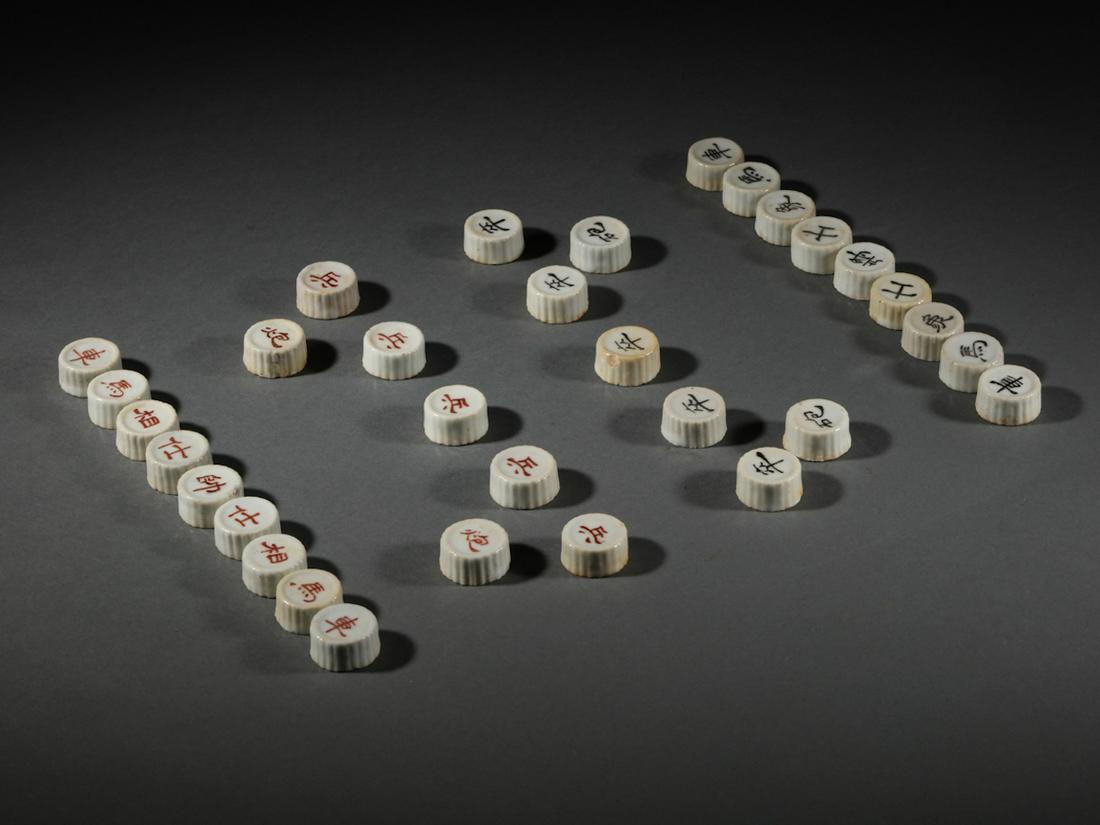 Chinese Porcelain Chess Set: 32 pieces. Height: 1.2cm Diameter: 2.5cm LOT 1 - 108, from Mr. Harold Mills, a Private collector from Boston, MA. His grandson entrusted us to auction off his collection after he passed away last year