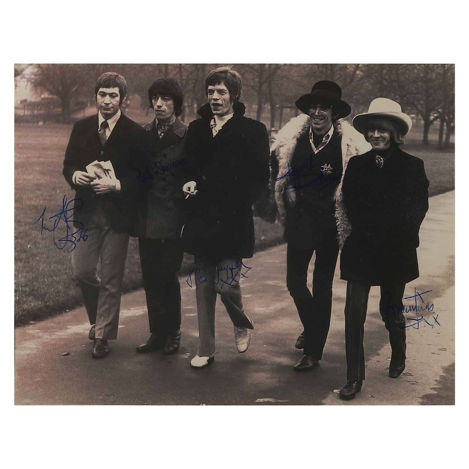 THE ROLLING STONES GROUP PORTRAIT: Title: THE ROLLING STONES GROUP PORTRAIT Material: Gelatin silver print, mounted on board Signature: Signed by the band members in blue ink Dimensions: Photograph 7 15/16 x 9 7/8 in. (20.1 x 25.1 cm);