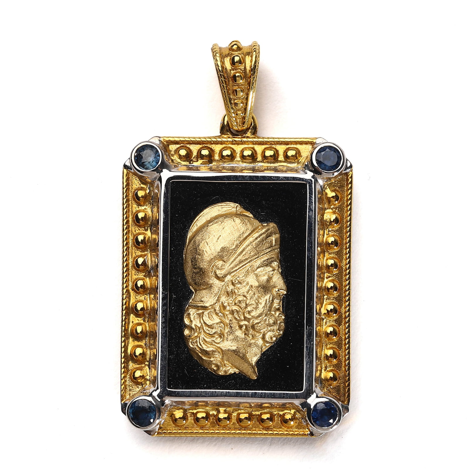 GOLD AND ENAMEL PORTRAIT PENDANT WITH SAPPHIRE ACCENTS: Dimensions: Length: 1 1/16 in. (27 mm); Width: 13/16 in. (21 mm); Weight: 10 g Description: An elegant rectangular pendant crafted in two-tone gold with a sculpted helmeted male profile in high relief