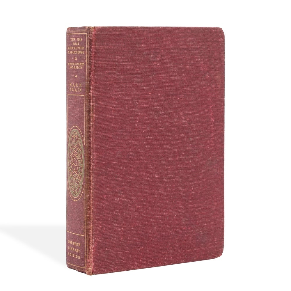 MARK TWAIN SIGNED "THE MAN THAT CORRUPTED HADLEYBURG AND OTHER STORIES AND ESSAYS": 8 3/8 x 5 5/8 in (21.3 x 14.3 cm) This signed copy of The Man That Corrupted Hadleyburg and Other Stories and Essays is associated with Mark Twain, one of the most influential and enduring figures in