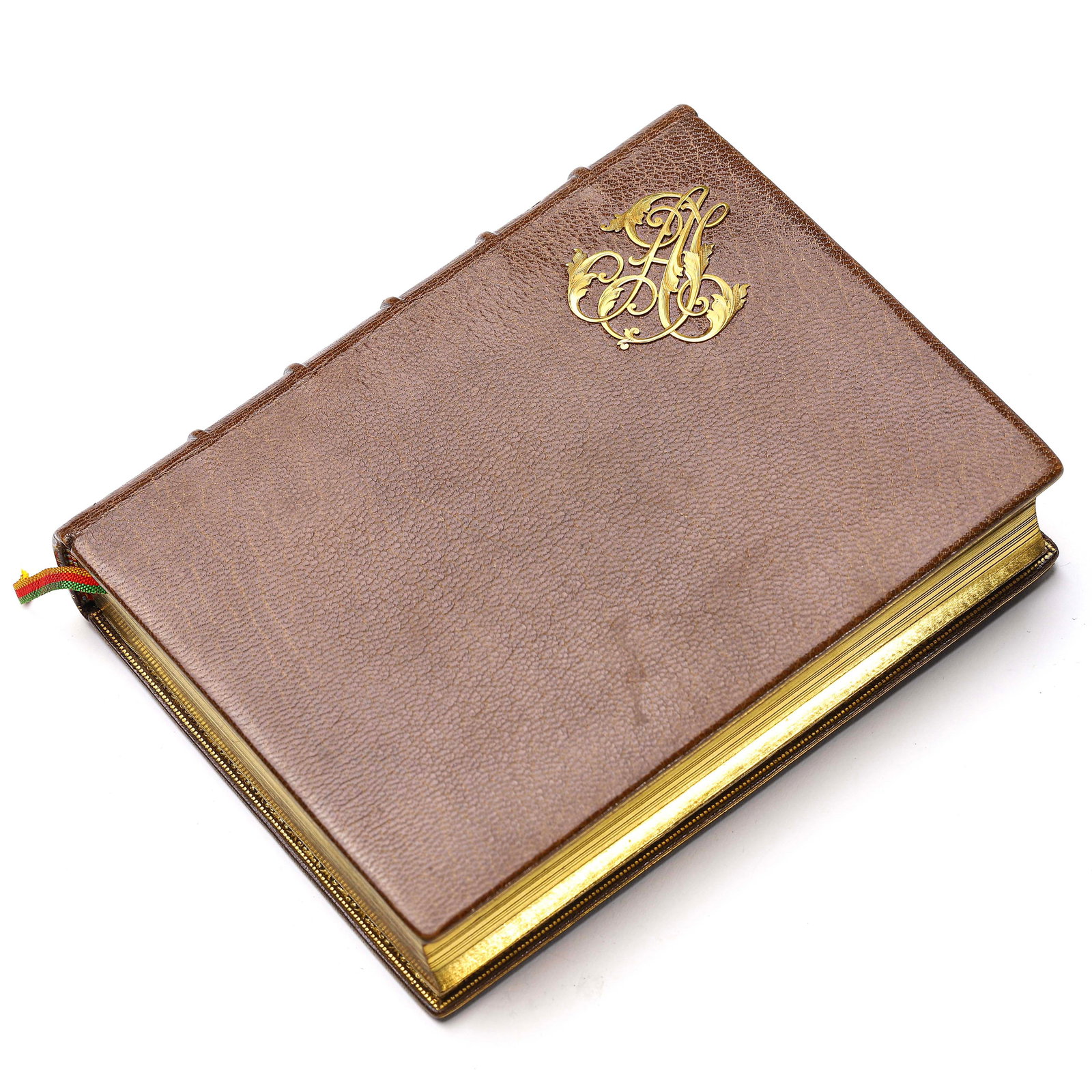 LEATHERBOUND GOLD COAT OF ARMS BOOK.: Length: 6 1/8 in (15.6 cm); Width: 4 3/4 in (12 cm); Thickness: 1 3/16 in (3 cm)