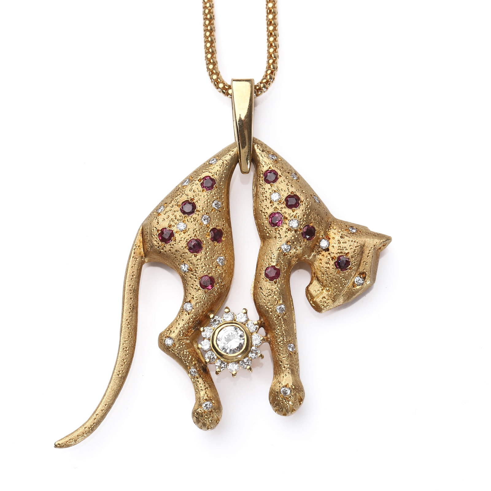 GOLD PANTHER PENDANT NECKLACE WITH RUBIES AND DIAMONDS: Dimensions Length: 31.9 cm; Weight: 32.5 g Description A finely crafted 18k gold pendant necklace featuring a stylized panther rendered with a matte-textured finish. The panther's body is accented wit