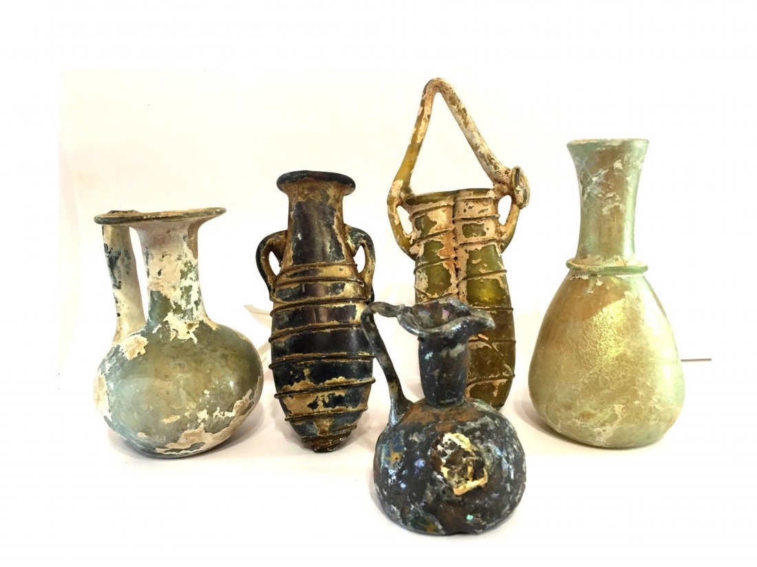 GROUP OF FIVE ANTIQUE ROMAN GLASS PERFUME BOTTLES: Group Of Five antique Roman glass Perfume Bottles Provenance: New York State Private Collector