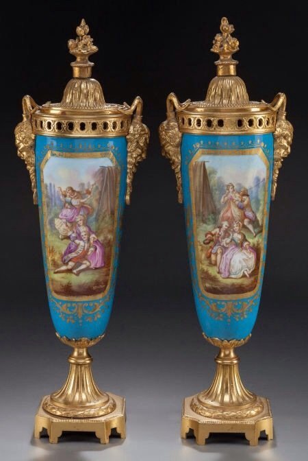 A PAIR OF 19TH CENTURY ORMOLU MOUNTED SEVRES VASES: A very fine pair of 19th century ormolu mounted Sevres porcelain vases, measuring 20" high , . Estimate $1.200-1.500