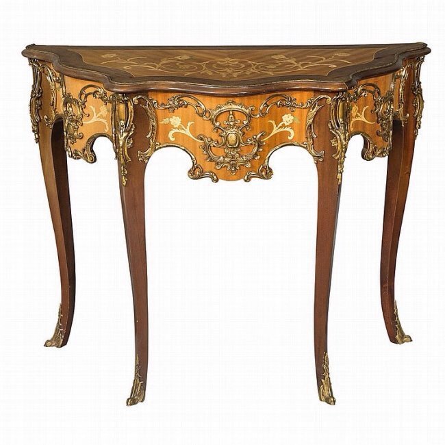 19TH CENTURY ORMOLU MOUNTED MARQUETRY CONSOLE: Measures : Height 31 1/2 inches, width 40 inches, depth 19 1/2 inches. Estimate $1.500-2.000