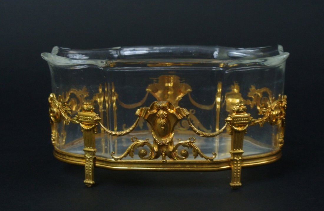GILT BRONZE AND CUT CRYSTAL BOWL: 7.5" L., 3.75" High , in excellent condition. Estimate $300-400