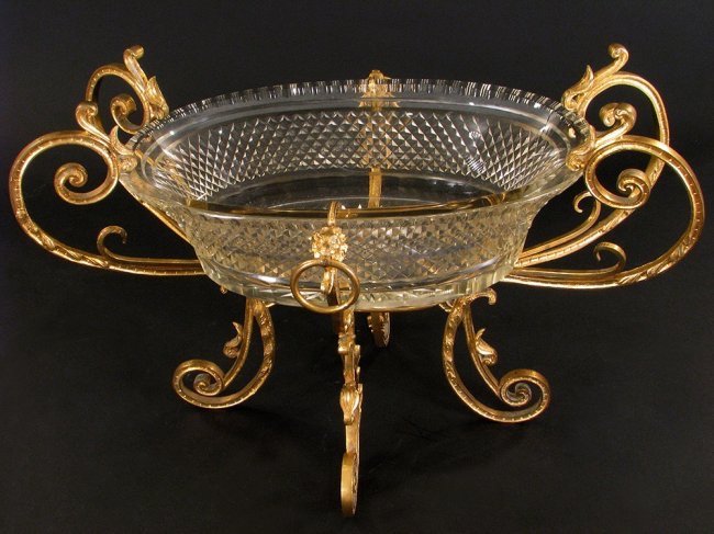 A LARGE GILT BRONZE AND BACCARAT GLASS CENTERPIECE: Estimate $1.500-2.000
