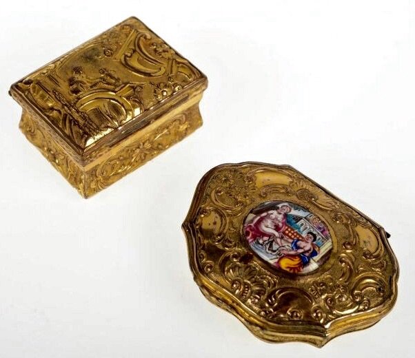 2 CONTINENTAL GILT AND ENAMELLED SNUFF BOXS: 2 Continental bronze snuff boxes, 18th/19th c., one with erotic-themed enamel reserve, .75"H x 2"Lx 1.5"D and 1"H x 1.5"L x 1"D. Estimate $500-600
