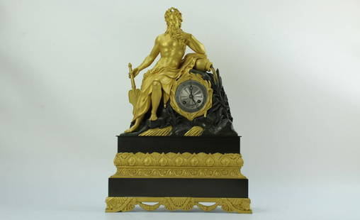 A shiny gilt brass clock with Neptune by Gilleon 1850: Ormolu and bronze clock and ornate case clock with a figure of Neptune. The silver chapter ring with black roman numerals. The case in Gothic design. Maker Gilleon circa 1850. H: 20 W: 14 inches