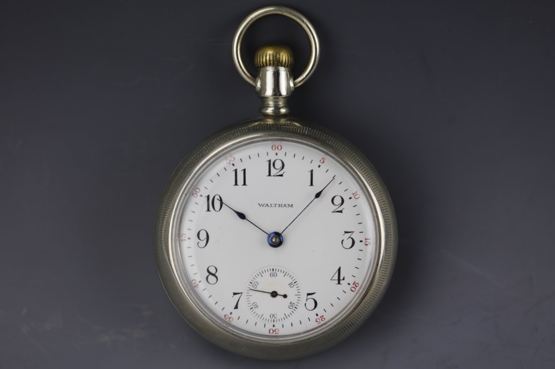 Vintage Waltham silver pocket watch with white dial: Vintage Waltham coin silver pocket watch with white dial and black Arabic numerals. No movements.D: 2.25 inches