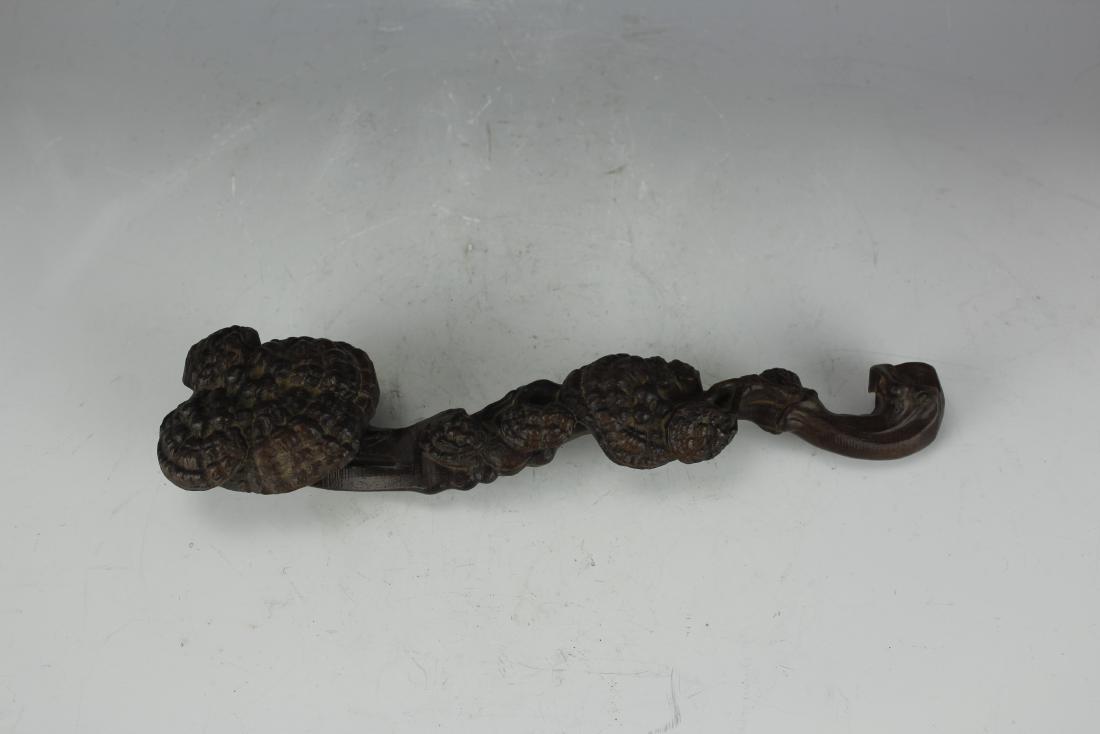 A Carved Ebony Ruyi: H: 11 W: 2.275