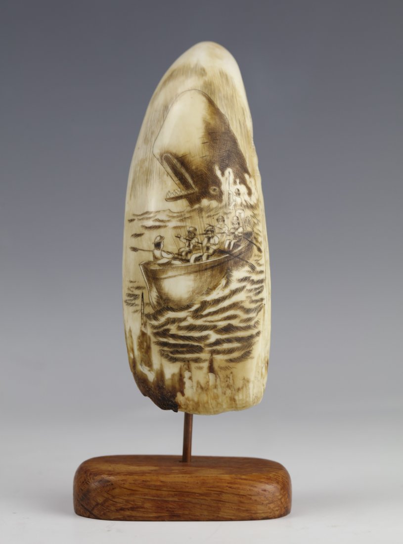 19th Century Scrimshaw Whale Tooth Moby Dick Hunting: 19th century scrimshaw depicting the hunting scene of whale hunters on a dinghy rowboat from Moby Dick, an 1851 novel by American writer Herman Melville.. H: 5.25 W: 2 Inches Weight: 221.3 Grams