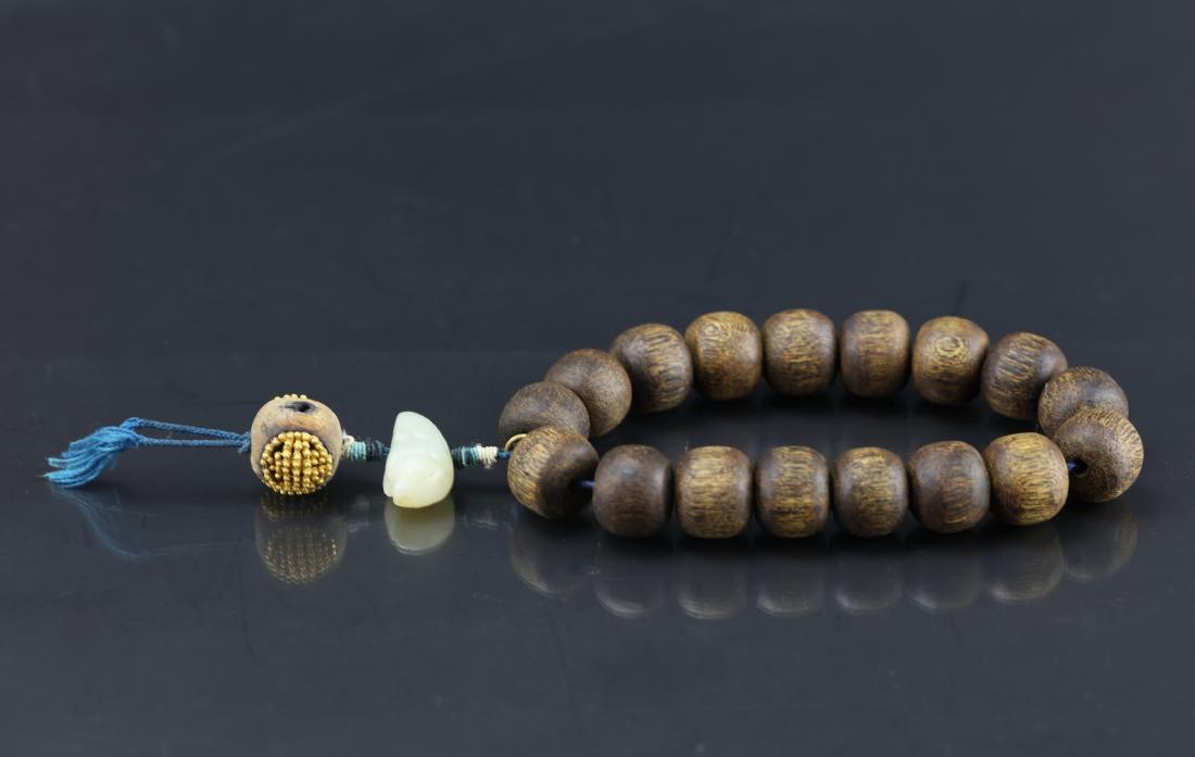 A Chinese Chenxiang Wood Bracelet (1 of 8)